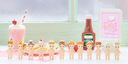 12 small figurines of Kewpie Babies with diner themed items atop their heads - such as burgers, hot dogs, coffee, milkshake, condiments, etc.