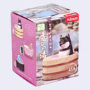 Product packaging with a cartoon dog in a bath tub on a pink background