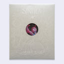 Gray patterned paper sleeve with a circular opening revealing an artwork inside - words on the exterior read "Sintila - James Jean"