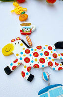 Decorative hanging with colorful horse clay sculpture, smaller charms including: a tangerine, cup of coffee, car and dog with a yellow tassel on a light blue background