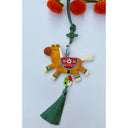 Tassel hanging of a flat clay sculpture of a brown and white horse with beads on a green tassel.