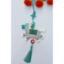Tassel hanging of a flat clay sculpture of a gray horse with beads on a teal blue tassel.