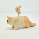 Ceramic cat figurine with a small yellow moon on its head, held up by a wire.