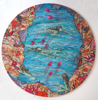 Painting on circle panel of a river, surrounded by colorful land with orange plants. 4 fish like woman swim in the lake, where pink jellyfish intermingle with them.