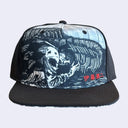 Black flat billed cap with a black and white sublimated graphic on the front of a person being consumed by a centipede.