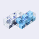 Set of 2 plastic erasers with many corners, encased in a clear box. One eraser is white and the other is blue.