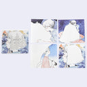 Set of four illustrated sheets of paper featuring a character in dreamy landscapes.