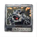 Vintage television set with a monster face on the screen