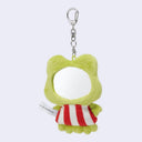 Green plush keychain with a red and white striped scarf on a light gray background