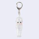 Clear Kewpie angel baby figure, standing with their arms behind their back attached to a silver keychain.