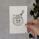 Ink illustration of a Tamogotchi doll.