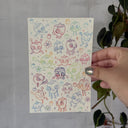 Lots of small sketches of cartoon strawberries.