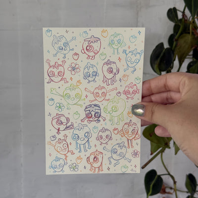 Lots of small sketches of cartoon strawberries.