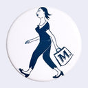 White circular button with a blue graphic of a woman walking and carrying a bag that says "M." on it. She is seen from the side, mid stride.