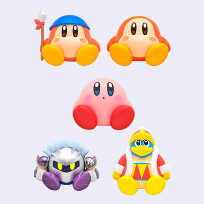 5 small figurines of Kirby characters, all sitting on their bottoms with no expressions or cute, surprised expressions. 