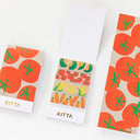 Two KITTA branded washi tape booklets with vegetable patterns on a white background