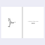 Open book with a black and white illustration of a person and text 'a collection of diary comics 2023' on a light gray background.