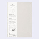 Kleid Notes Tiny grid notes 86 color Gray notebook shown closed, featuring a light gray textured cover with a white vertical information label on the left side.