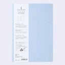 Light blue notebook cover with subtle silver embossed designs and words along the sides.