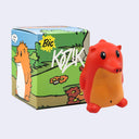 Red and orange hedgehog toy figure with 'Kozik' branding next to a colorful box featuring cartoon characters.