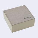 Thick memo pad with a gray pleather cover with cursive writing on it reading "kurasky"