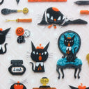 Collection of black cat-themed stickers on a white background