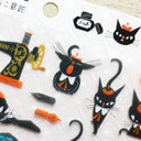 Collection of black cat-themed stickers on a white background