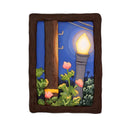 A rectangular sculpture made to look like a miniature painting within a "wooden" frame of a painted night scene, showing a glowing streetlamp, blue sky, green foliage, pink flowers, next to a wooden telephone pole, with wires hanging overhead.