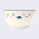 Off-white bowl with illustrations of sea animals, such as polar bear, dolphin, fish, otter, penguins, etc.