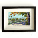 Framed artwork of the LA River, seen from a concrete bike path with shade covering it partially.