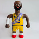 Toy figure of Lebron James in a Lakers jersey with a purple sash on a white background