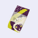 Folded fabric with a lemur design and Morita Mill branding on a light purple background