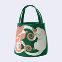 Green tote bag with a pink lemur design with another white lemur reaching for its tail.