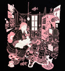 Black t-shirt with a pink graphic design on the front of a girl sitting in a room full of decorative items, plants, art supples and manga. 