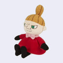 Plush doll of Little My from Moomin with a top ponytail, a red dress and a tiny pink bowtie with a mischievous expression.