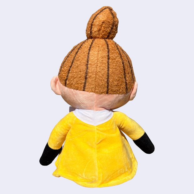 Plush doll of Little My, a character with a mischievous look, a tall orange ponytail and a yellow dress. Back view.