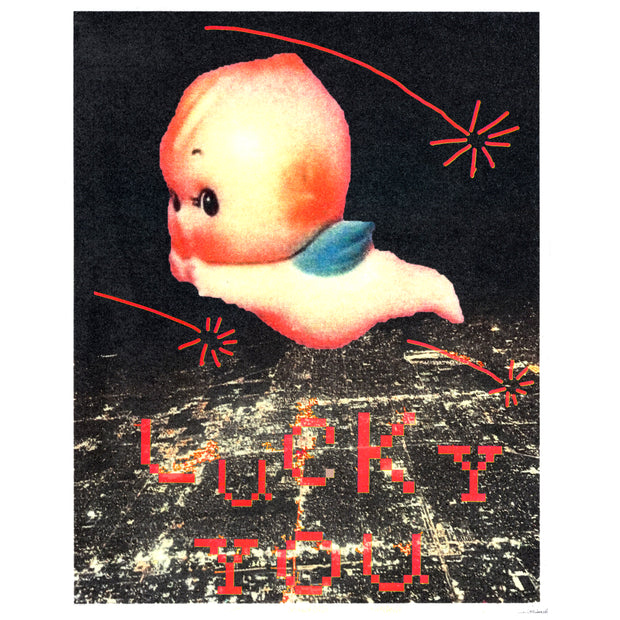 Screenprint of a lit up city at night, seen from overhead and far away as if in a plane. A large Kewpie baby flies overhead, with red shooting stars and pixilated text that reads "Lucky You."