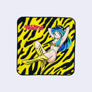 Rounded corner square towel featuring Lum from Urusei Yatsura in her classic outfit, sitting on the ground with her arms behind her head. The show's logo is in upper left and background is a yellow and black striped pattern, akin to a tiger.