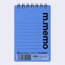 A blue spiral-bound notepad with black wire binding, lined writing space, and large vertical 'm.memo' text on the front, photographed on a light gray background.