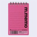 A pink spiral-bound notepad with black text reading 'm.memo' vertically on the right side, lined writing area on the left, and maruman branding at the bottom.