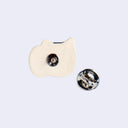 Back of a ceramic pin with a metal pin and backing.
