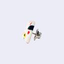 3D ceramic brooch/pin of a maneki cat's head with one paw raised upward. It has a smile, yellow eyes and a red collar. Side view.