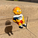 Figure of Martin Prince from The Simpsons, wearing a shirt that says "Wang Computers", sitting and holding a book at his side. 