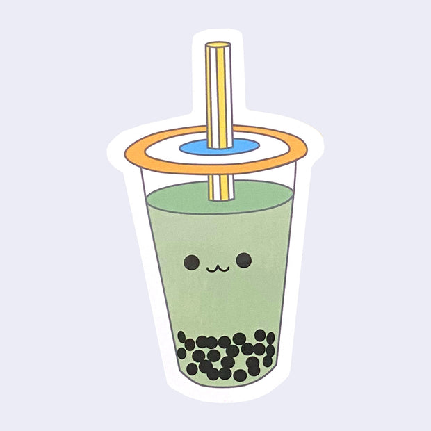 Die cut sticker of a cup of green tea boba with a simple smiling face on the cup.