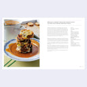 Stacked grilled cheese croutin with tomato soup on a plate, with text on the right side.