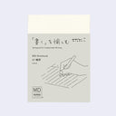 MIDORI MD Notebook in A7 sizing with a sleeve featuring a hand holding a pen illustration and some specs.