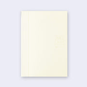 Cream-colored notebook with grid patterned binding and "MD paper" branding on the side.