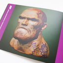 Open 2 page spread from MHZine005 of digital sculpts of the bust of an older man, bald with tattoos and an angry expression.