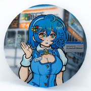Painting of an anime girl with blue hair and wearing a blue attendants outfit which fits tightly and emphasizes her chest. The buttons on her shirt are the old Microsoft logo, same with her hair pin. She waves nervously, with buildings blurry in the background. A computer text bubble reads "welcom to michaelsoft binbows!"