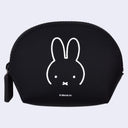 A black zippered cosmetic pouch featuring a white line art illustration of the Miffy bunny face and the text '© Merci bv' below it, set against a light gray background.